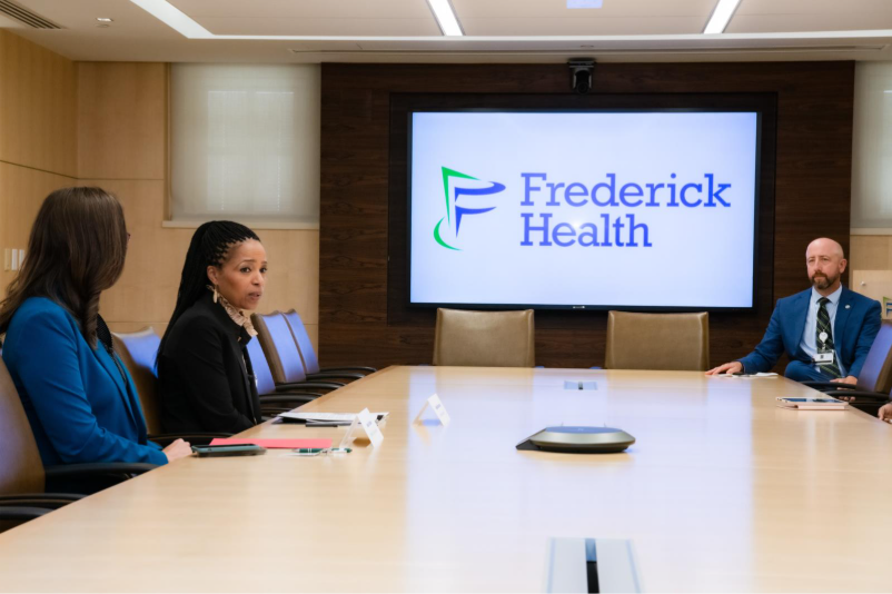 Senator Alsobrooks speaks at Frederick Health with leaders about the importance of Women's Health in a conference room