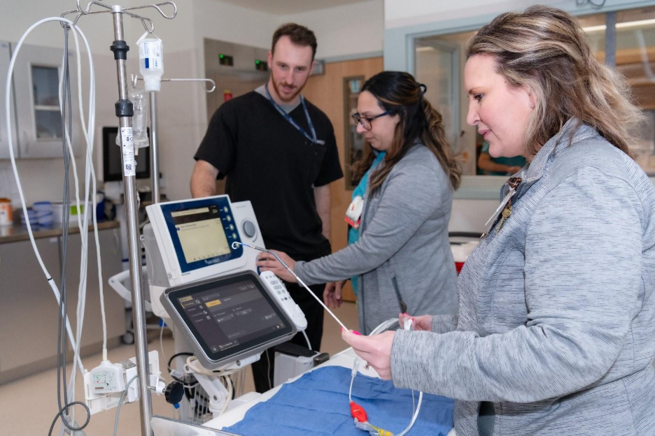 Frederick Health professionals inspect Impella, the world's smallest heart pump, in a patient room